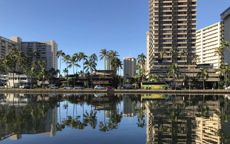 The three-block-wide tourist district of Waikiki is bounded by the Ala Wai Canal (shown here) on one side and the Pacific Ocean on the other.//Timothy A. Schuler